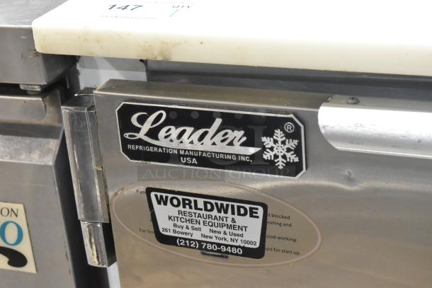 Leader LM36 S/C stainless steel commercial sandwich salad prep table, mega top, 115V, on commercial casters. Visible branding plates.
