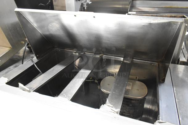 Leader LM36 S/C stainless steel sandwich salad prep table, mega top, commercial casters, visible wiring and metal interior, 115V.