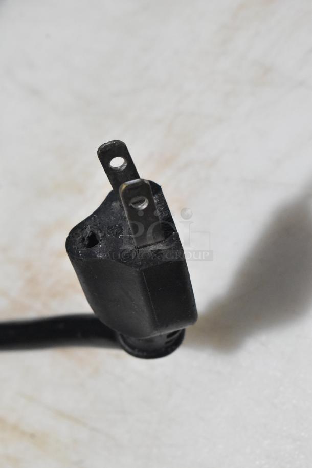 A close-up of the plug from the Leader LM36 S/C commercial sandwich salad prep table, showing a standard two-prong plug.