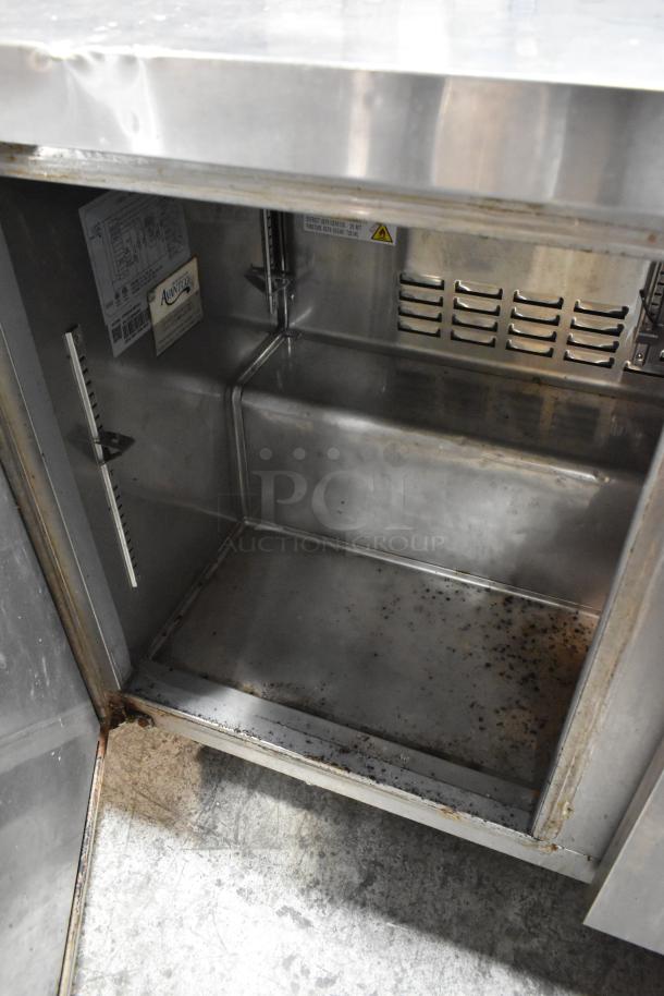 Avantco 178SSUC48FHC stainless steel 2-door undercounter freezer, interior view showing condition and ventilation.