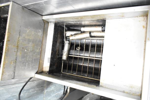 Atosa ATFS-40 stainless steel commercial fryer, propane gas powered, 90,000 BTU. Shows interior condition with heating tubes.