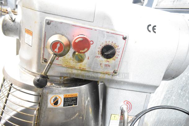 Skyfood commercial planetary dough mixer with mixing bowl, guard, hook, paddle, and whisk. Metal build, visible wear.