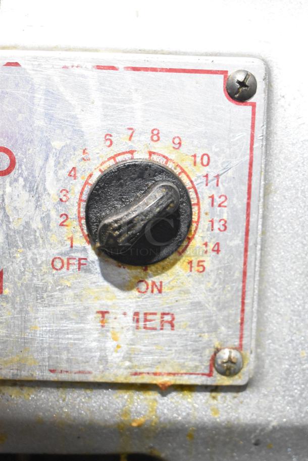 Skyfood metal commercial planetary dough mixer control panel, showing a timer dial with numbers 0-15 and an ON/OFF switch.