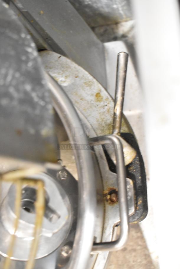 Skyfood commercial dough mixer with bowl guard visible, rust and wear present, includes bowl, dough hook, paddle, whisk.