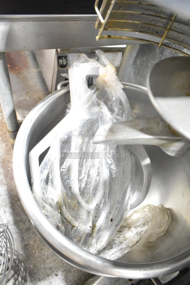 Skyfood Metal Commercial Planetary Dough Mixer with mixing bowl, bowl guard, dough hook, paddle, and whisk attachments.