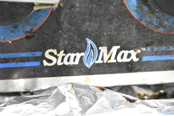 Star Max logo on a commercial countertop gas-powered stainless steel 6-burner range, shown in used condition.