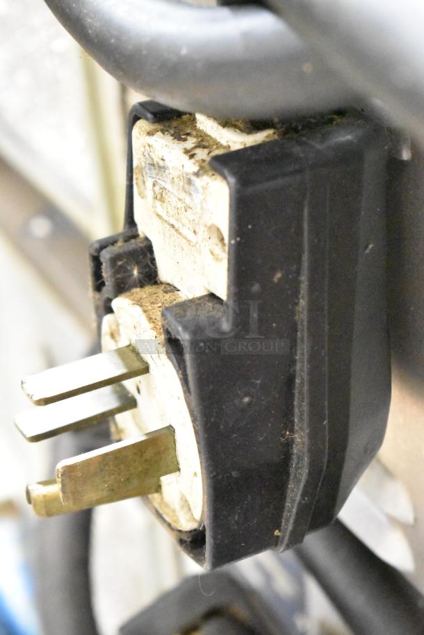 Close-up of a connector for a Turbochef HhC2020 commercial rapid cook conveyor oven, 208/240V, 3 phase.