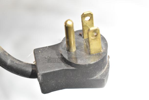 Power plug of Beverage Air UCR48A undercounter cooler, showing three prongs for 115 volts, single phase connection.