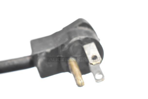 Close-up image of a three-prong plug from a Beverage Air WTR60A commercial cooler.