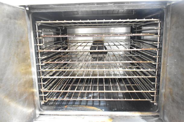 Garland Master 200 stainless steel convection oven interior; features multiple metal racks, sturdy construction, thermostatic controls.