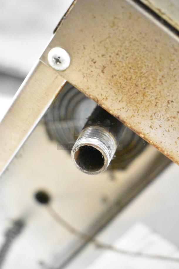 Garland Master 200 stainless steel convection ovens, solid doors, metal racks, thermostatic controls. Visible wear, commercial use.