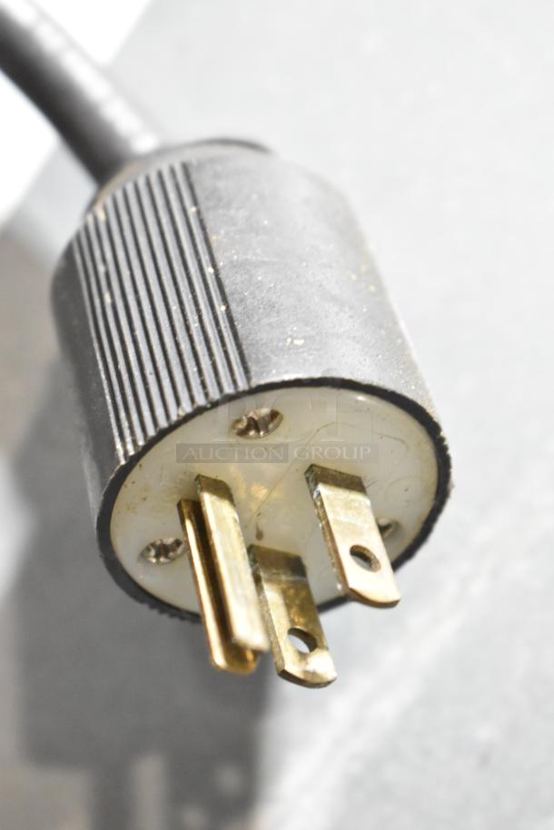 Power plug of a 2018 Koolaire commercial ice machine, 125 volts, 1 phase, showing three-prong configuration.