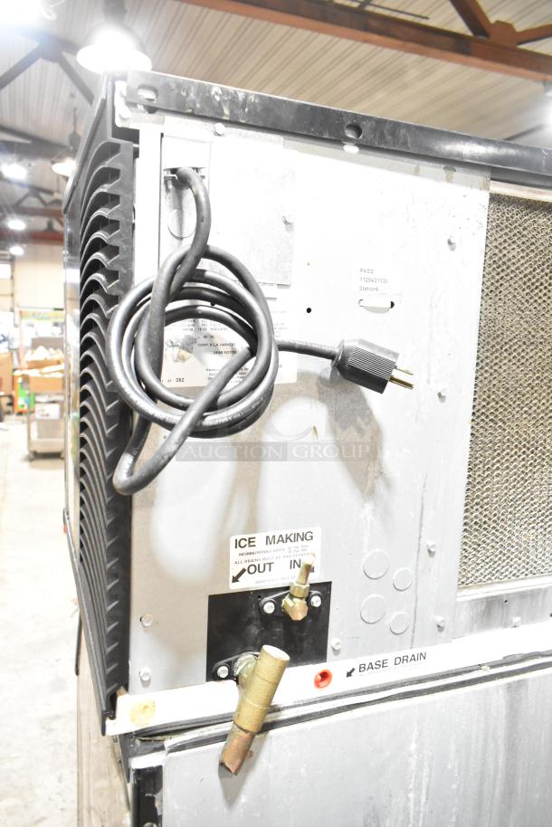 2018 Koolaire stainless steel commercial ice machine head on Manitowoc K570 bin. Features ice making and base drain labels.