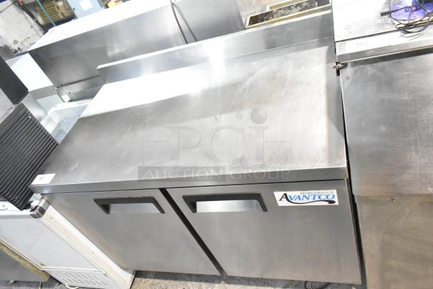 Avantco 178AWT48FHC stainless steel 2-door work top freezer on casters, with visible brand label, in good condition.