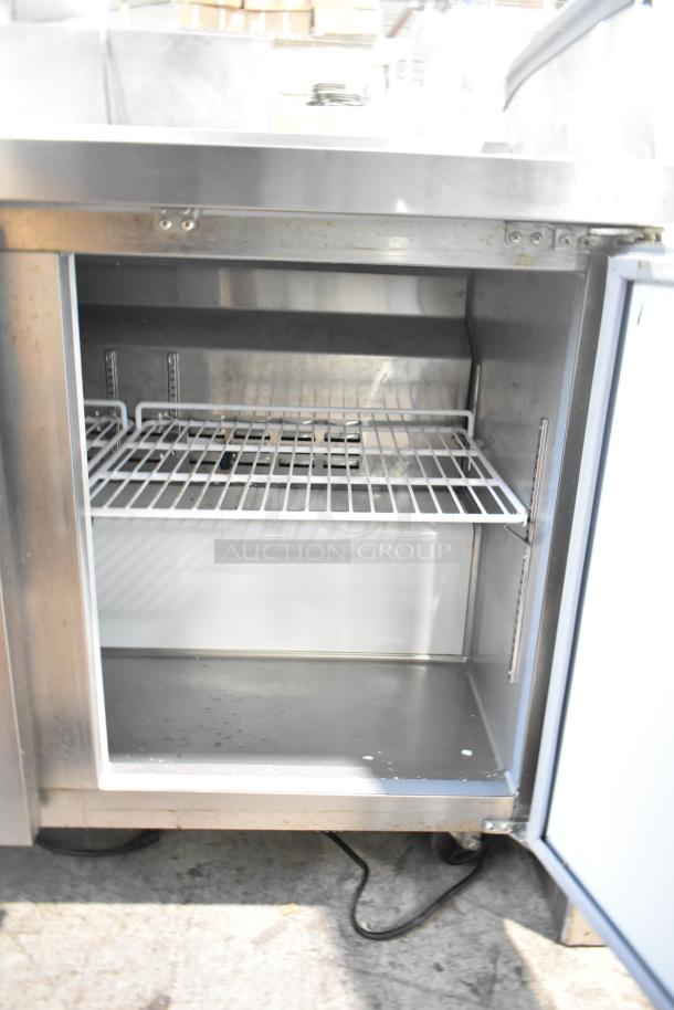 Avantco 178AWT48FHC stainless steel 2-door work top freezer, commercial casters, interior shelf, 115V, good condition.