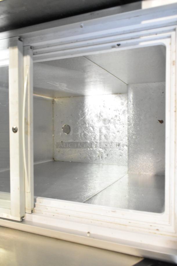 XS-160YX Metal Chest Merchandiser, 110 Volts, 1 Phase. Visible interior with metal finish, some wear marks. Model XS-160YX.