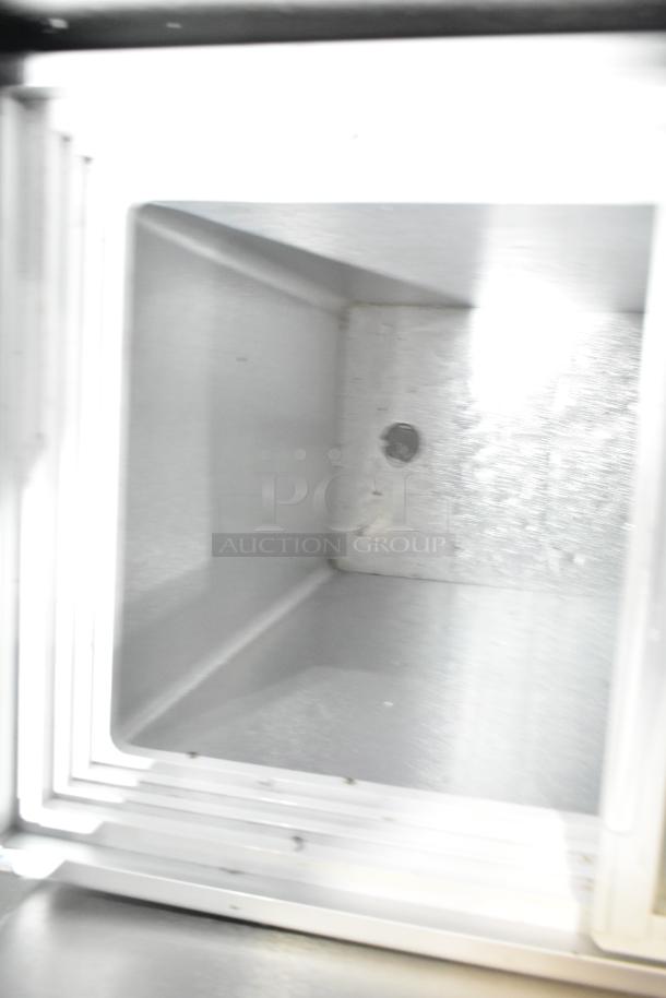 XS-160YX Metal Chest Merchandiser interior, showing smooth metal walls, suitable for 110 volts, 1 phase operation.