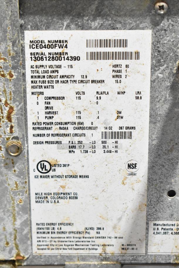 Ice-O-Matic ICE0400FW4 stainless steel commercial ice machine tag showing model, serial number, and electrical specs.