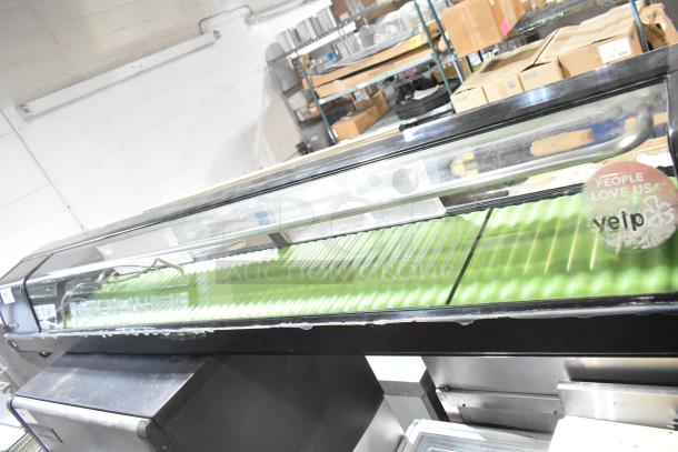 Hoshizaki HNC-210AA-L metal sushi display case, commercial countertop model, 115V, 1 Phase, with glass top and green interior.