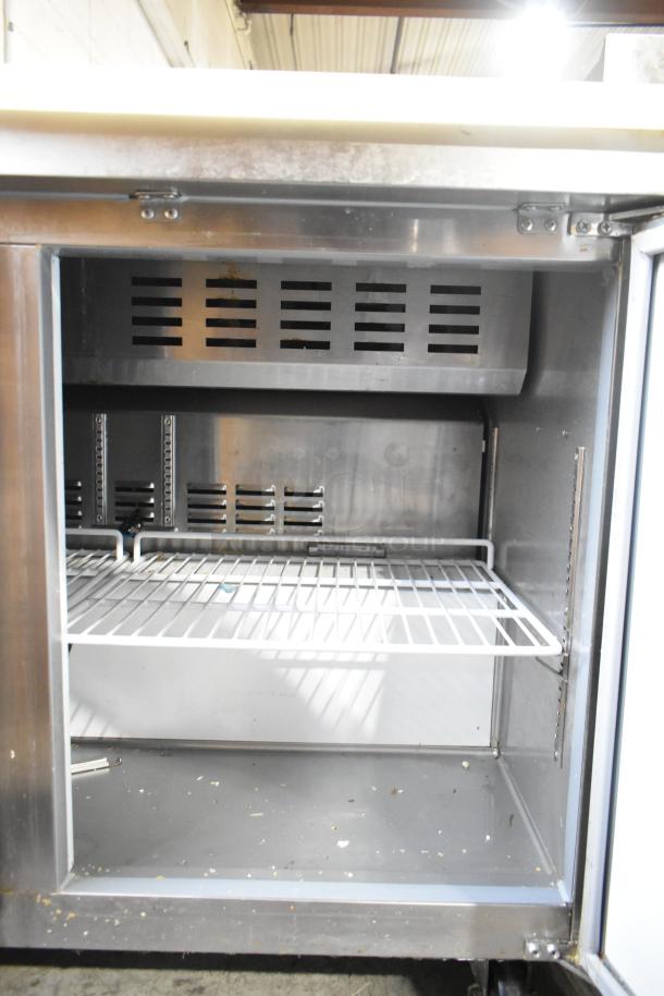 Avantco 178APT48HC stainless steel sandwich salad prep table, visible interior shelf, commercial casters, 115V, used condition.