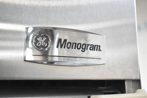 General Electric GE Monogram stainless steel cooler, single door. Features 115 volts, 1 phase. Monogram branding visible.