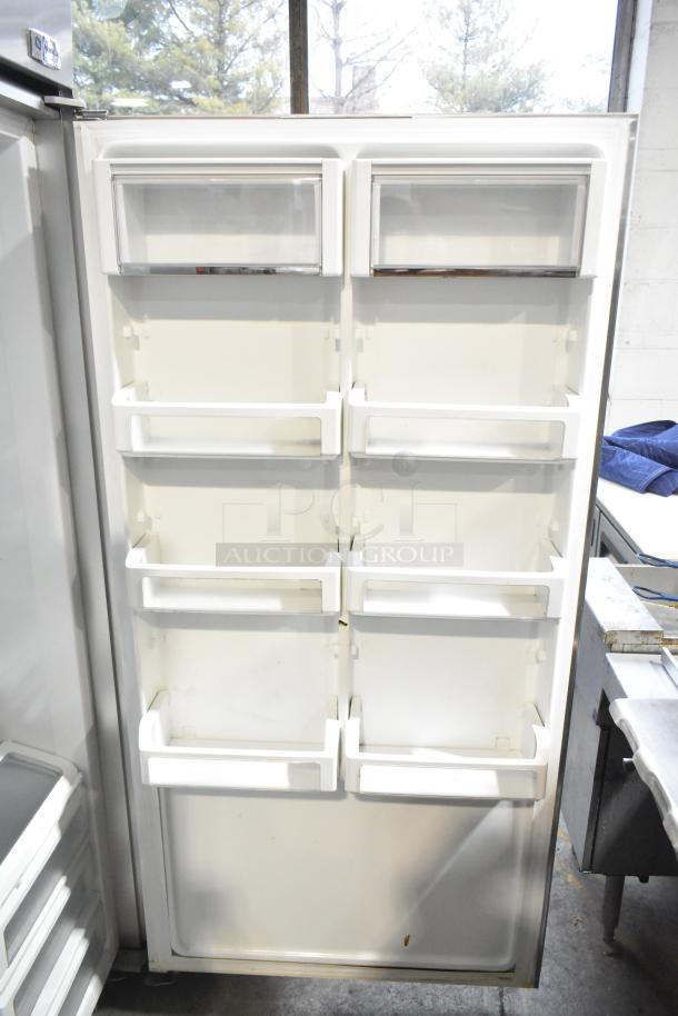 General Electric GE Monogram single door stainless steel reach-in cooler, 115 volts, 1 phase, interior shelves visible.