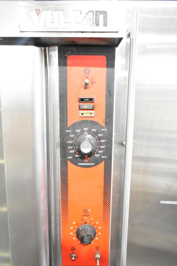 Vulcan VC4GD-11D350K stainless steel gas convection oven with view-through doors, metal racks, and thermostatic controls.