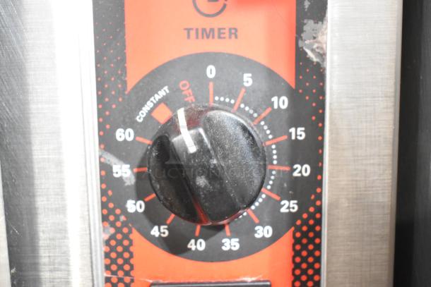 Vulcan steam cabinet timer dial, black with red and white markings, adjustable from 0 to 60 minutes, stainless steel edge.