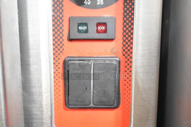 Control panel of Vulcan Stainless Steel Steam Cabinet with "Ready" and "Cook" indicators, black buttons, and a temperature dial.
