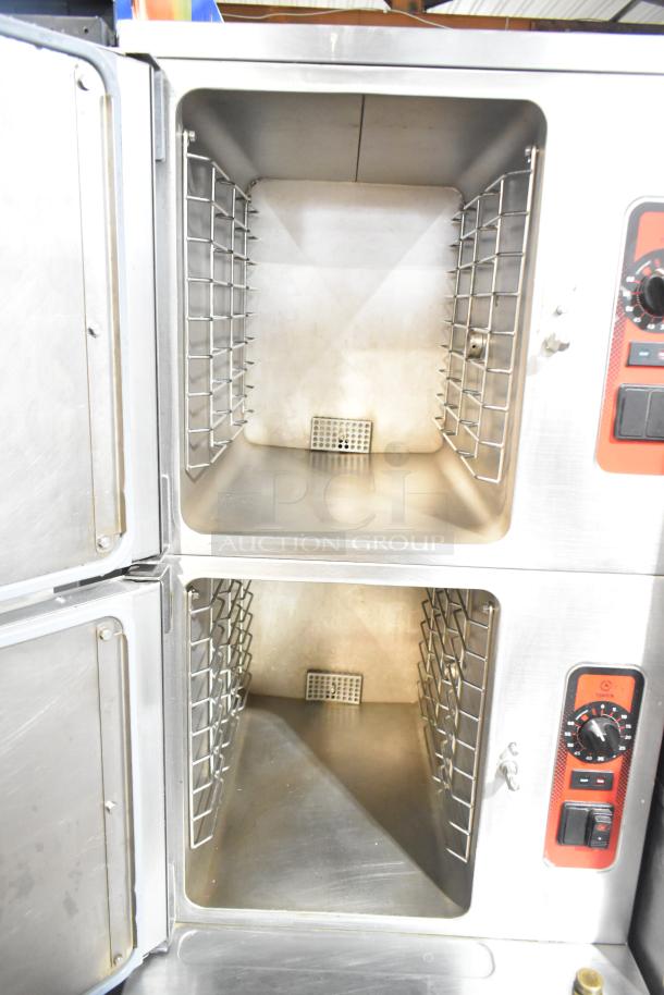 Vulcan stainless steel commercial steam cabinet with two decks, interior racks, and control knobs. Floor style, excellent condition.