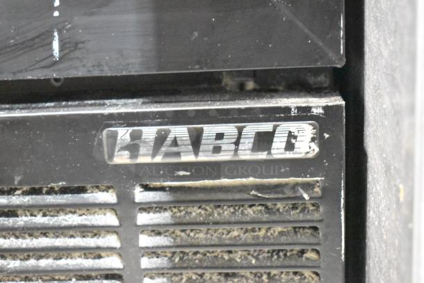 Habco ESM28 commercial cooler, metal single door, poly coated racks, 115 volts, visible Habco branding, some wear shown.