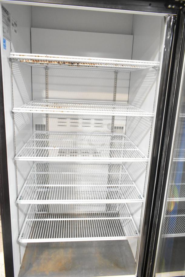 Habco ESM28 metal commercial cooler with single glass door, poly-coated racks; shows rust on shelves, 115V, 1 phase.