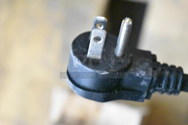 Close-up of a Habco ESM28 cooler's three-prong power plug, showing standard U.S. plug configuration.