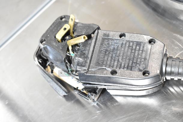 Damaged electrical plug of a 2025 Avenli AV1000SP inflatable hot tub. Black plastic casing with exposed wires. 120 Volts, 1 Phase.