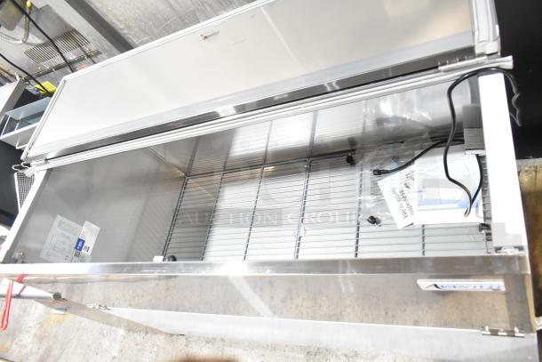 Brand new Avantco 178MC58HC stainless steel commercial milk cooler with minor scratches. Includes original tags and wiring.