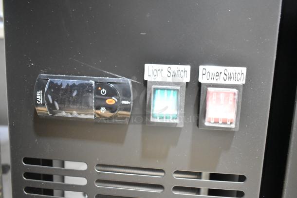 Close-up of Avantco 178UDD48HC kegerator control panel showing Carel temperature display, green light switch, and red power switch.