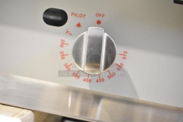 BRAND NEW Cooking Performance Group stainless steel gas griddle. Thermostatic control knob with temperature markings.