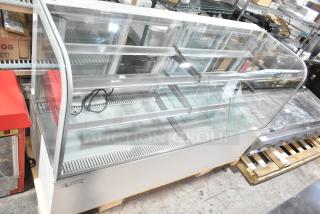 Brand new Avantco 193BCD72W 72" curved glass white bakery display case, metal construction, 110-120V, 1 Phase.