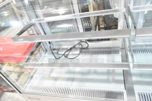 Brand new Avantco 193BCD72W 72" curved glass bakery display case, white metal, scratch and dent, 110-120V, 1 phase.
