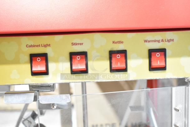 Carnival King 382PMW17R popcorn machine controls, featuring switches for cabinet light, stirrer, kettle, and warming light.