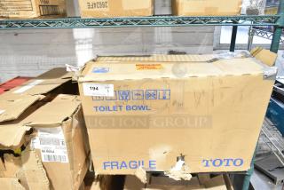 BRAND NEW Toto CT725CUFG#01 toilet in original packaging. Features TORNADO FLUSH®, top spud, floor mounted, universal height.