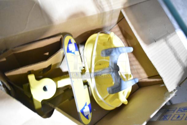 BRAND NEW S19224FW Halo eye/face washer bowl, yellow, shown in open cardboard packaging.