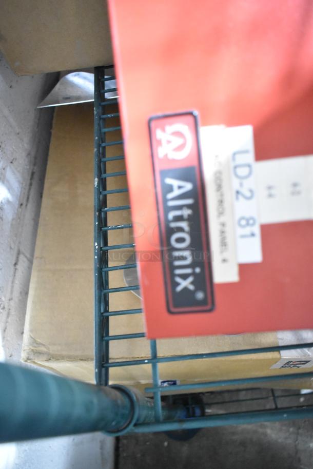 Altronix AL1002ULADA fire alarm box, red casing, visible label. Includes additional items, condition appears used.