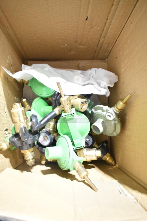 Box of 5 brand new green and brass gauges, plastic-wrapped, in a cardboard box; includes brand labels and connectors.