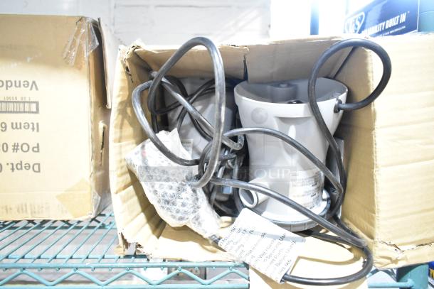 Brand new 302001003726 Flowclear 330 gal. filter pump in box, with visible packaging and coiled cables.