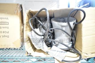 Brand new 302001003726 Flowclear 330 gal. filter pump in box, with visible packaging and coiled cables.