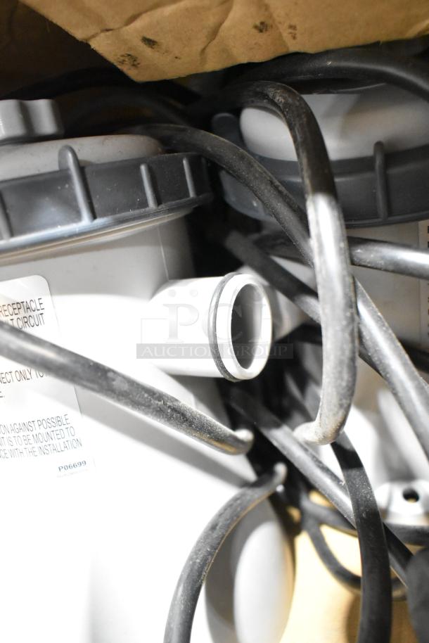 BRAND NEW! Flowclear 330 gal. filter pump, model 302001003726, tangled cords, visible labeling.