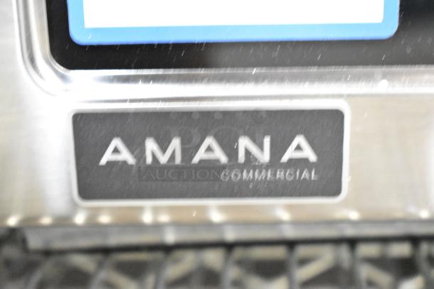 Brand new Amana RCS10TS stainless steel commercial microwave. Visible "Amana Commercial" label. Stackable, 120V, 1 Phase.