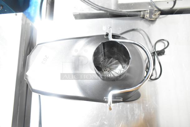 AvaMix 928JE700 stainless steel juice extractor, new with scratch and dent. Continuous feed, pulp ejection, 120V. Tag indicates "203."