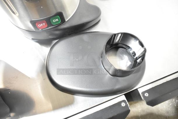 AvaMix 928JE700 stainless steel juice extractor, new with minor scratches, features pulp ejection, 120V, 1 phase.